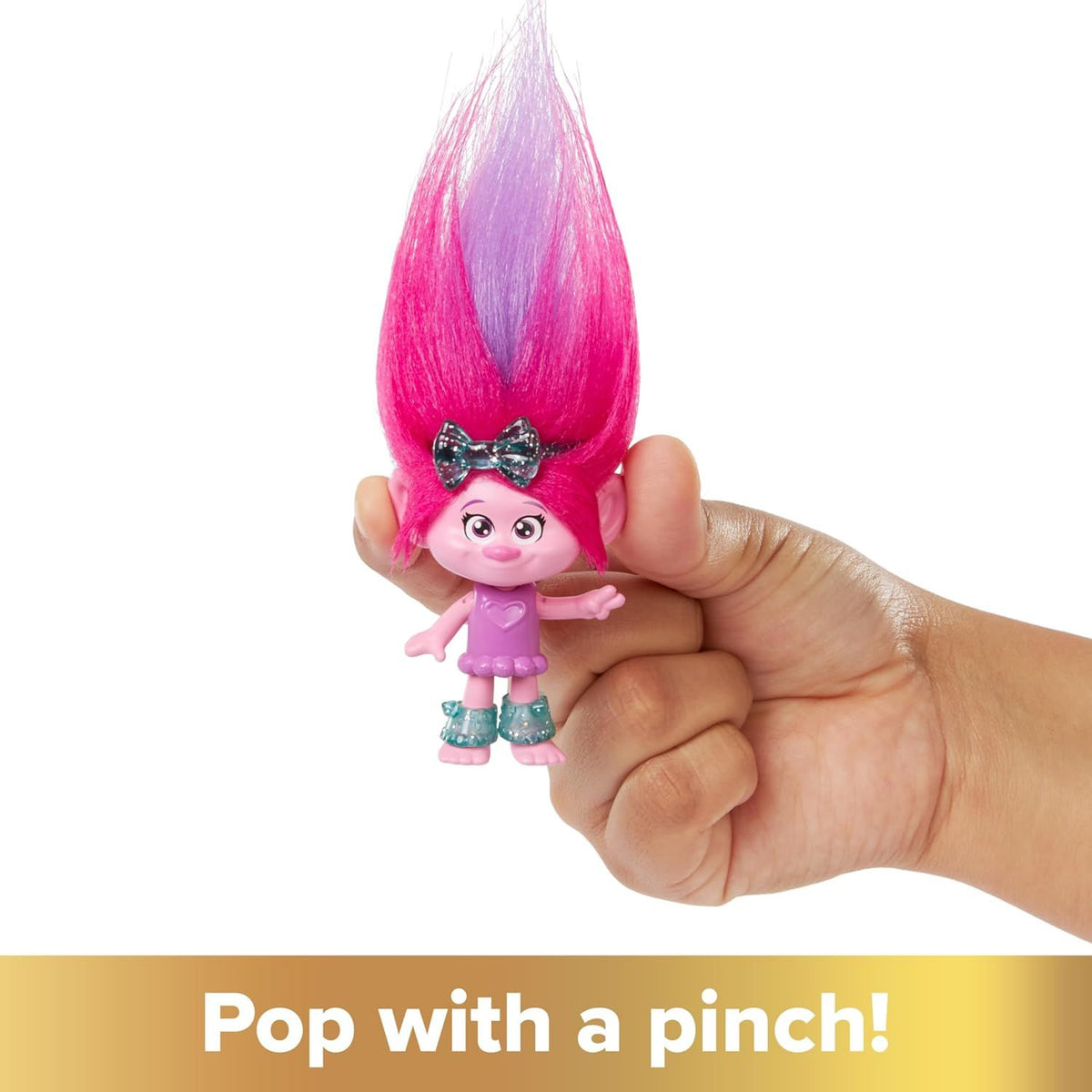 hand holding poppy hair pops doll