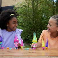 girls playing with poppy hair pops doll