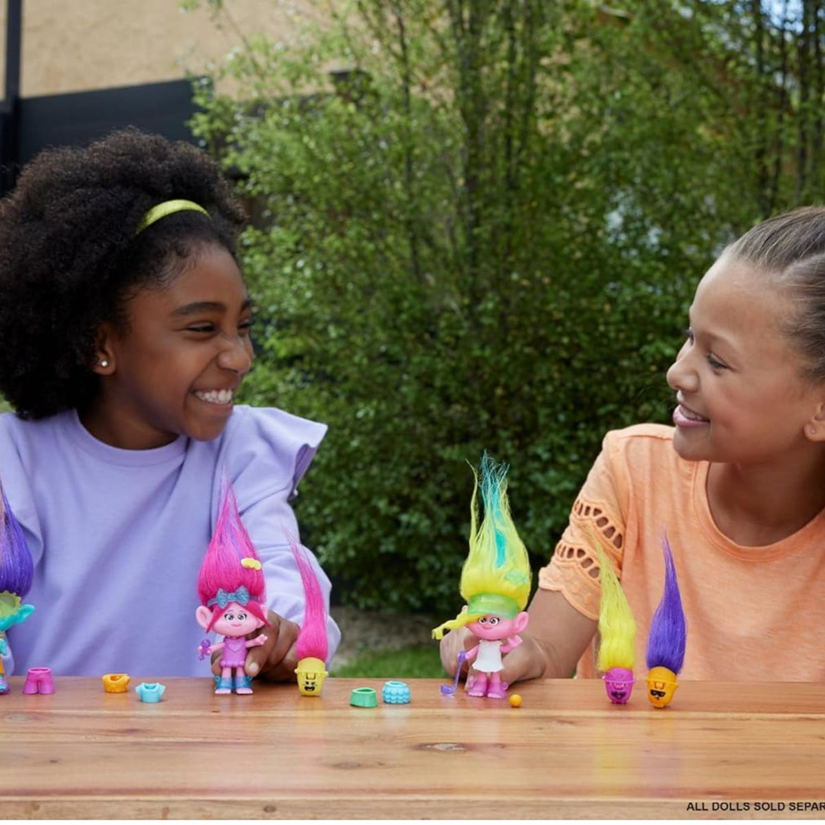 girls playing with poppy hair pops doll