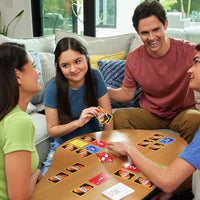 family smiling playing uno zero