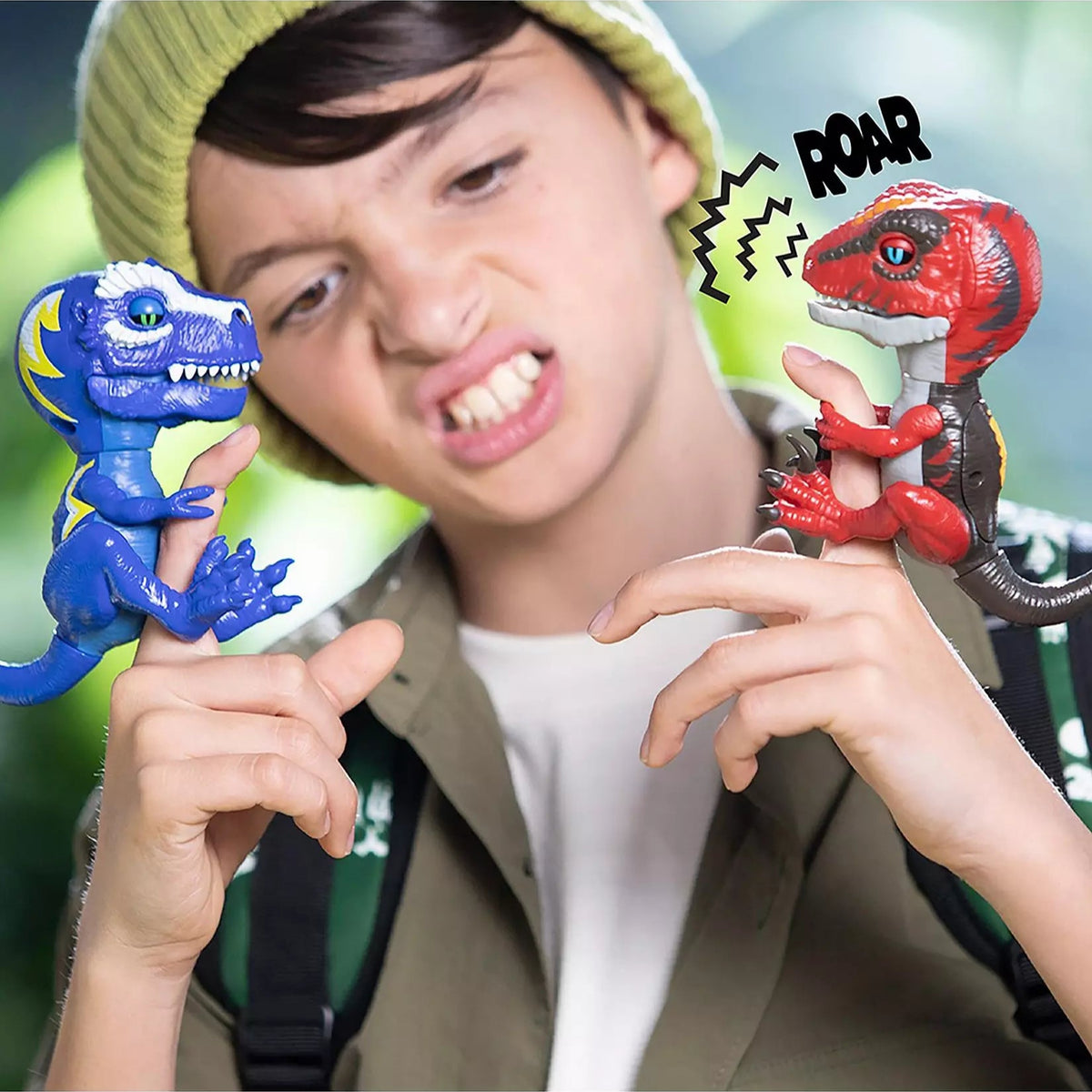red and blue dinosaurs on boys finger 