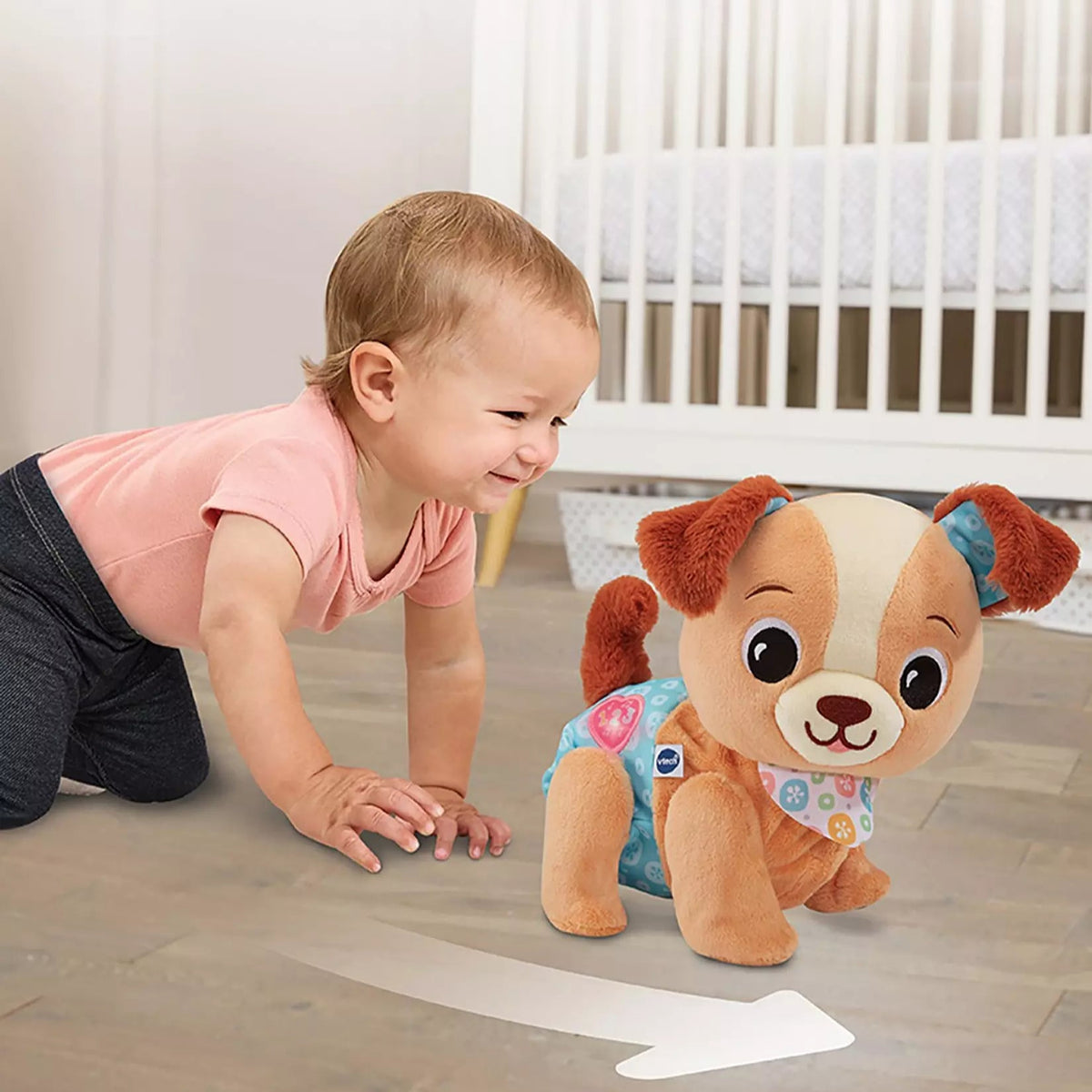 baby playing with plush interactive puppy 