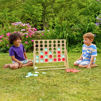 children playing with four in a row set 