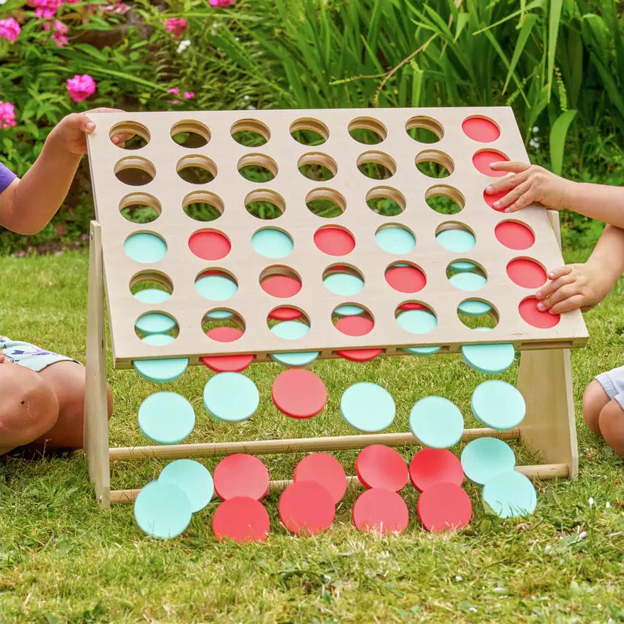 children removing disks from four in a row set 