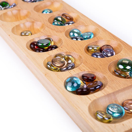 close up of wooden mancala game 