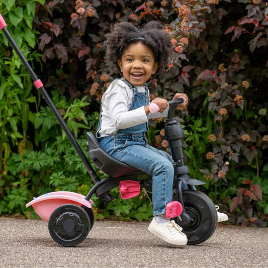 child riding unicorn trike 