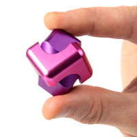 child playing with the Bopster Fidget Spinner Cube Pink & Purple