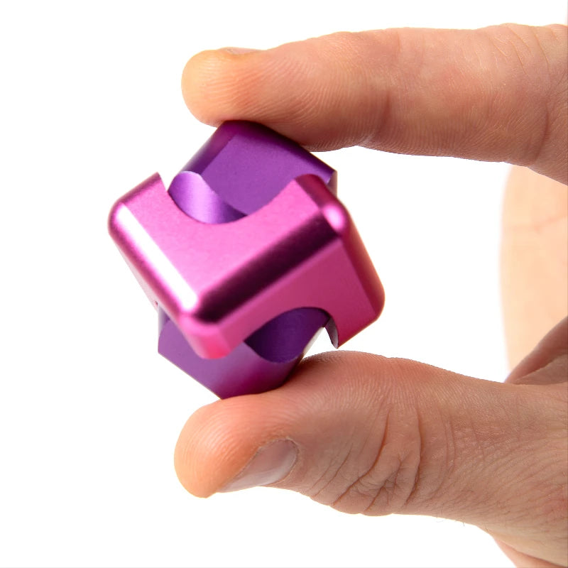 child playing with the Bopster Fidget Spinner Cube Pink & Purple