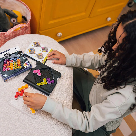 child playing with iq gears game 