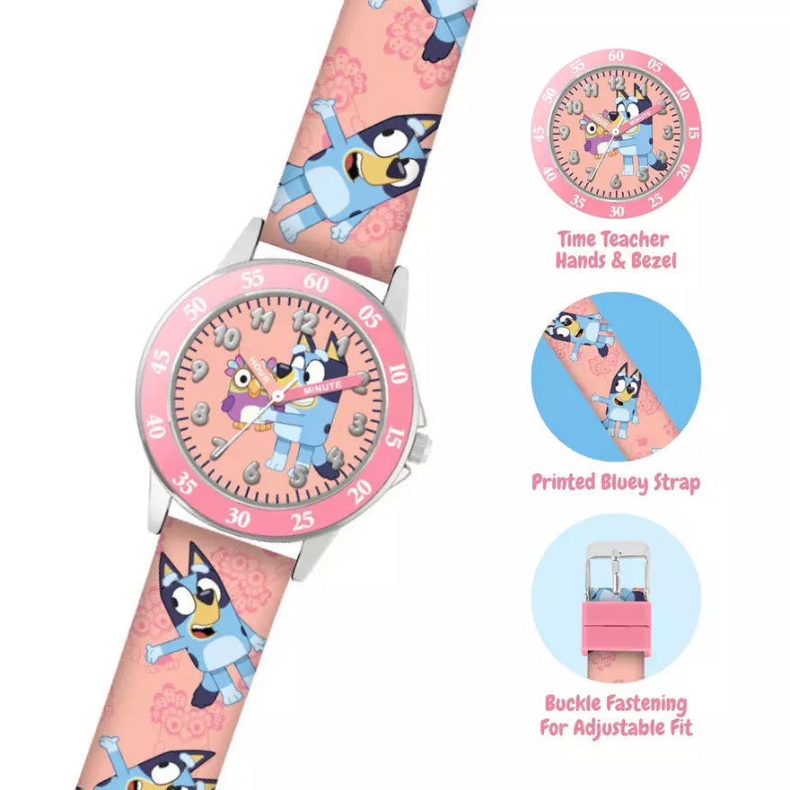 Close-up of the Bluey Pink Strap Time Teacher Watch with time teacher hands, printed Bluey strap and adjustable buckle fastening on a white background. 