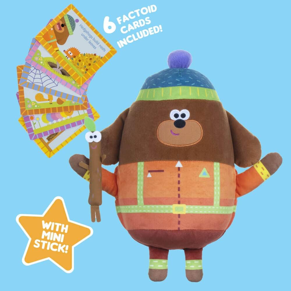 Plush toy bear with factoid cards on a blue background