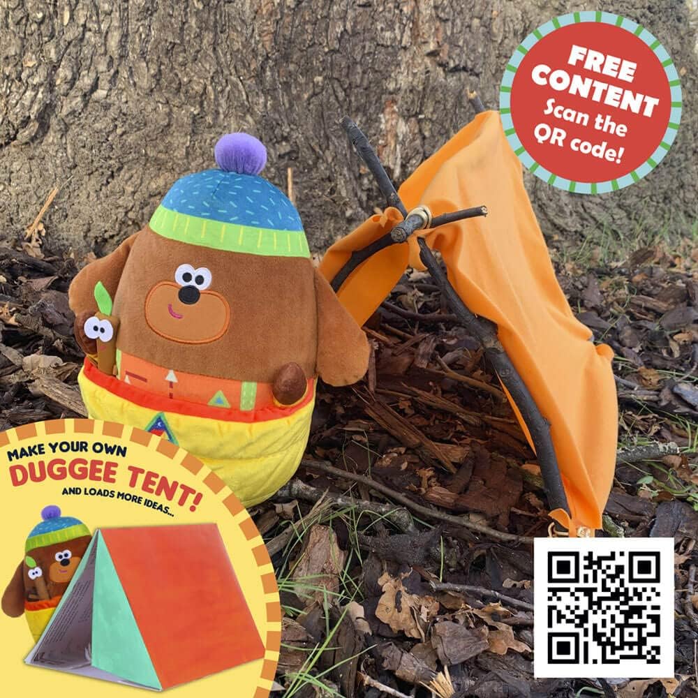 Toy dog with a tent and QR code on a natural background