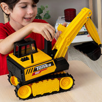 A child playing with the Tonka Excavator