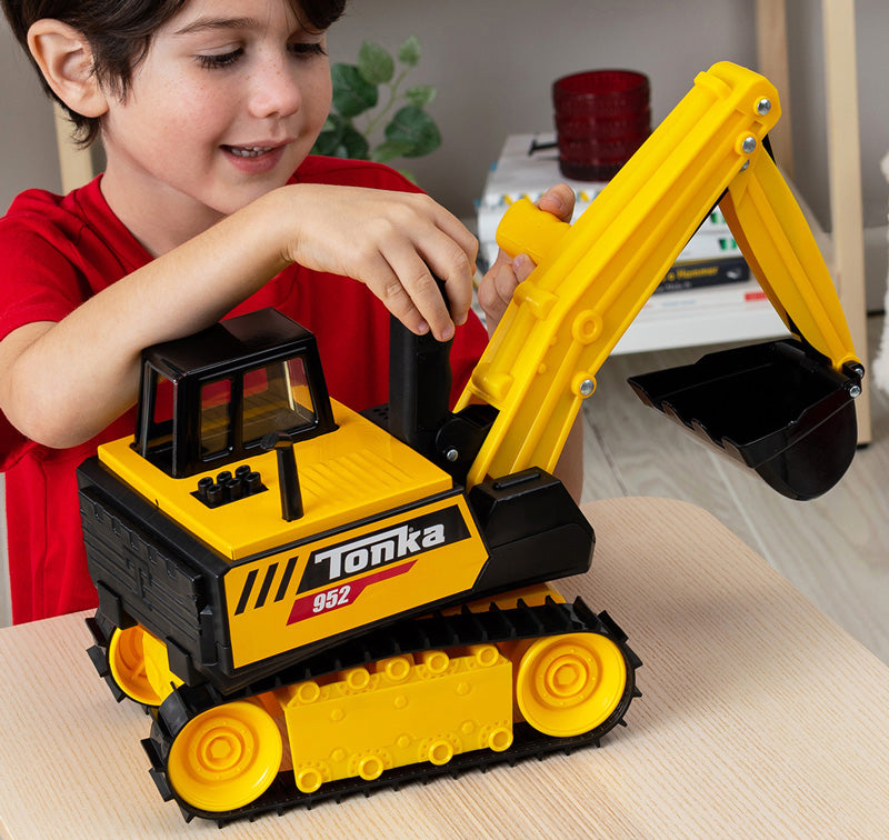 A child playing with the Tonka Excavator