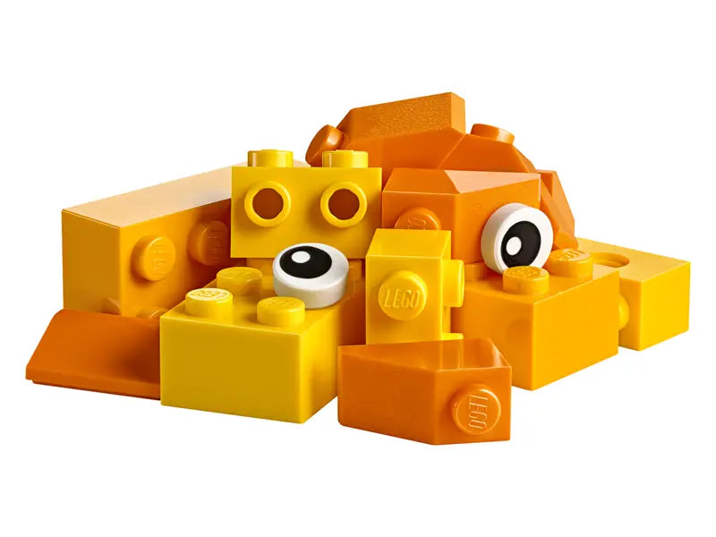 Close-up of LEGO bricks, wheels, and eyes in the suitcase