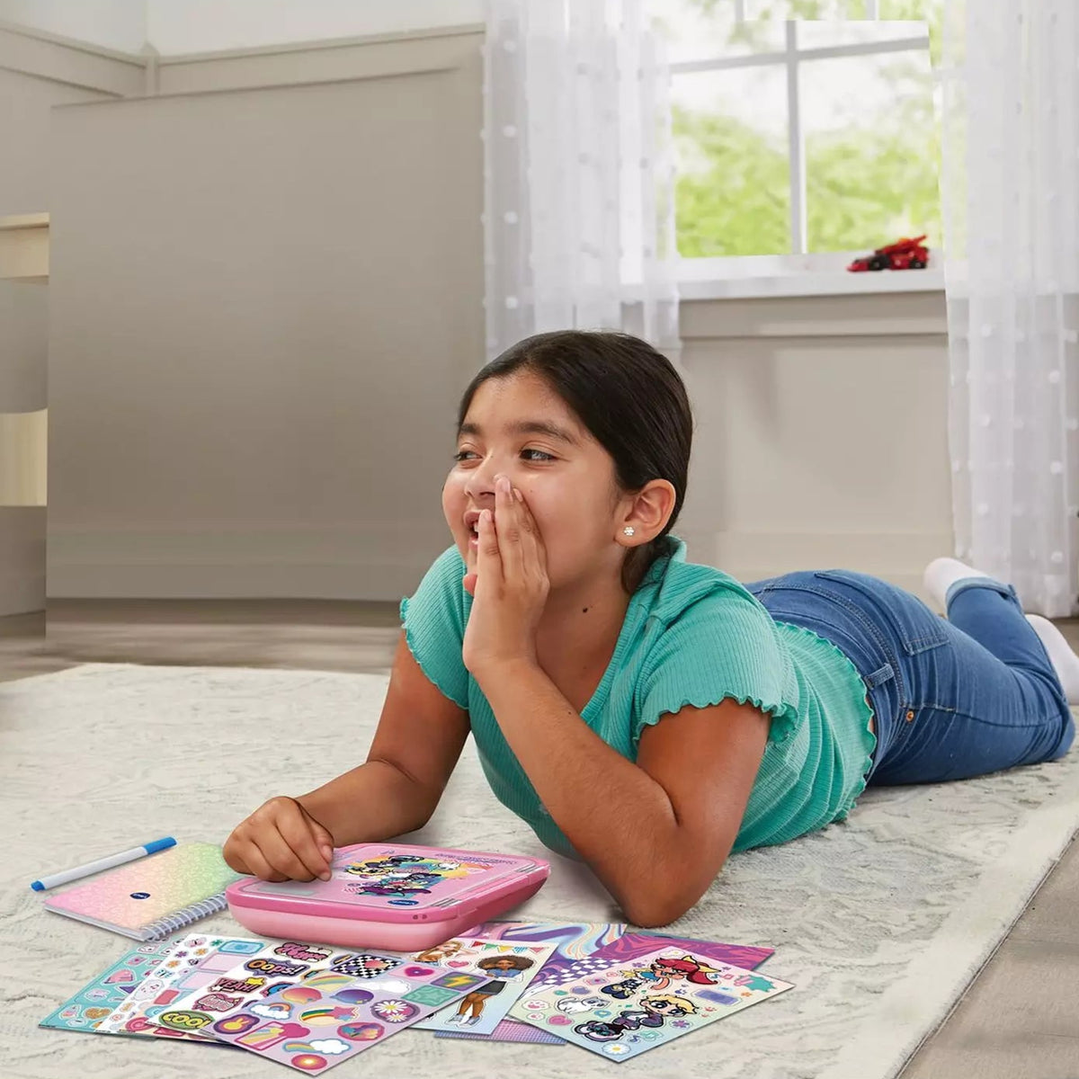 Girl playing with toys on a carpeted floor in a room with a window.