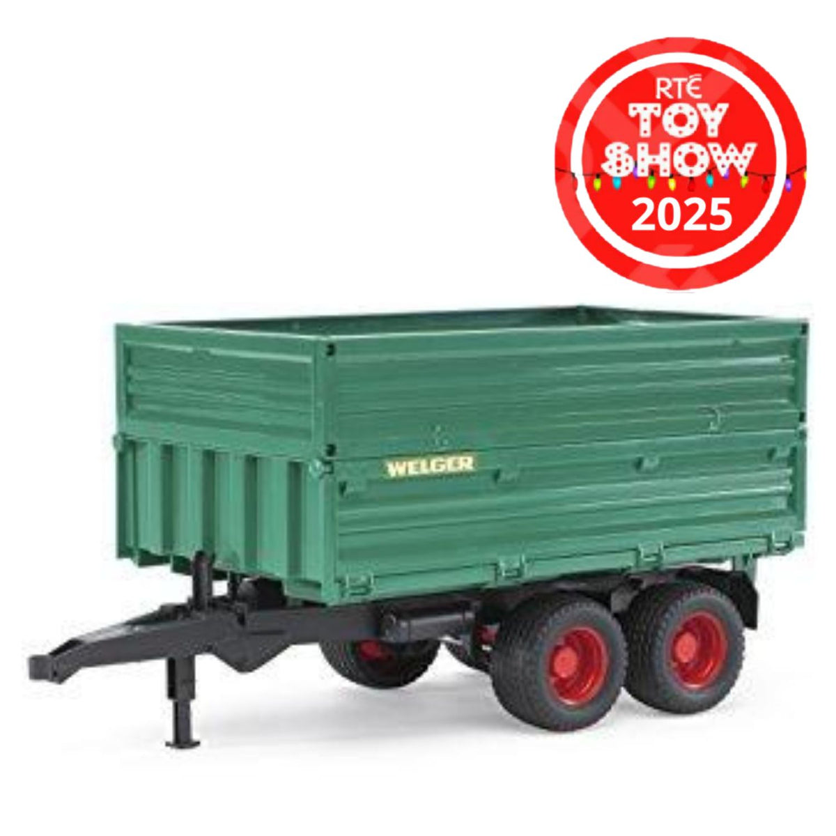 Green toy trailer with red wheels and 'WELGER' branding, featuring an RTE Toy Show 2025 badge.