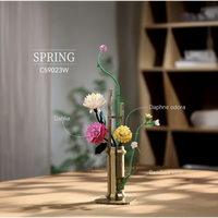 Features a freestanding floral arrangement in a decorative pot