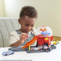Candy shop-inspired playset with interactive racing action