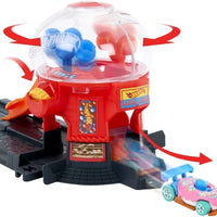 Liftable ramp sends vehicles into the gumball machine feature