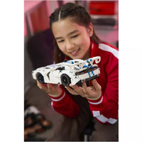 toys at foys - technic  girl holding car