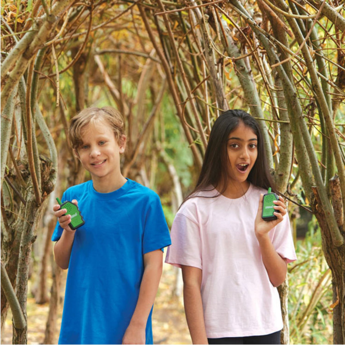 two kids holding walkie talkies