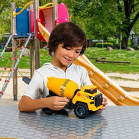 child playing with construction truck